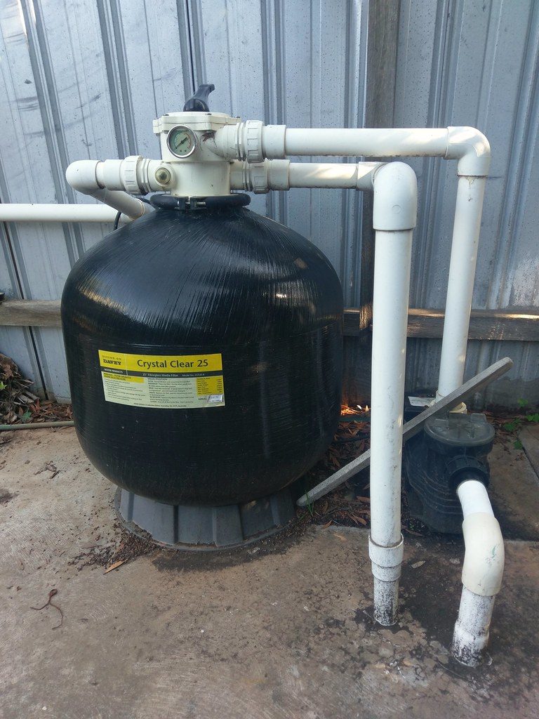 sand filter tank plumbed with white upvc pipework